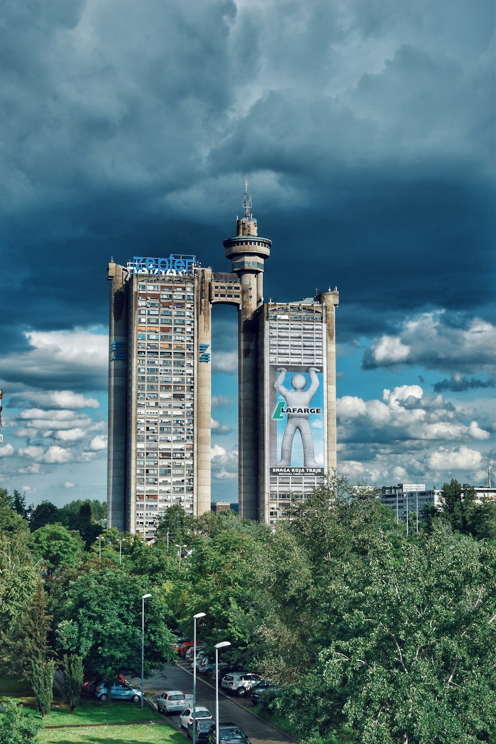 brown and blue concrete building under blue sky during daytime