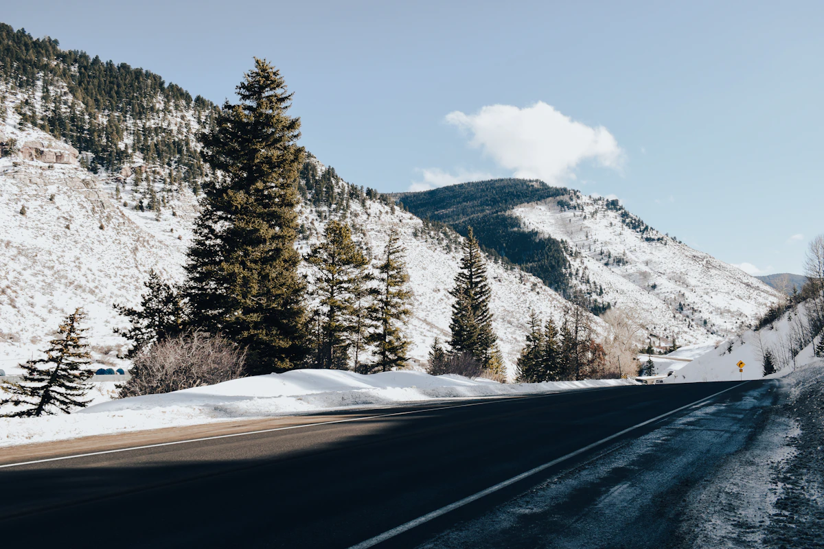 A snowy mountain road through the Colorado Rockies on the drive to the Vail Valley