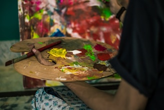person holding brown wooden handle knife