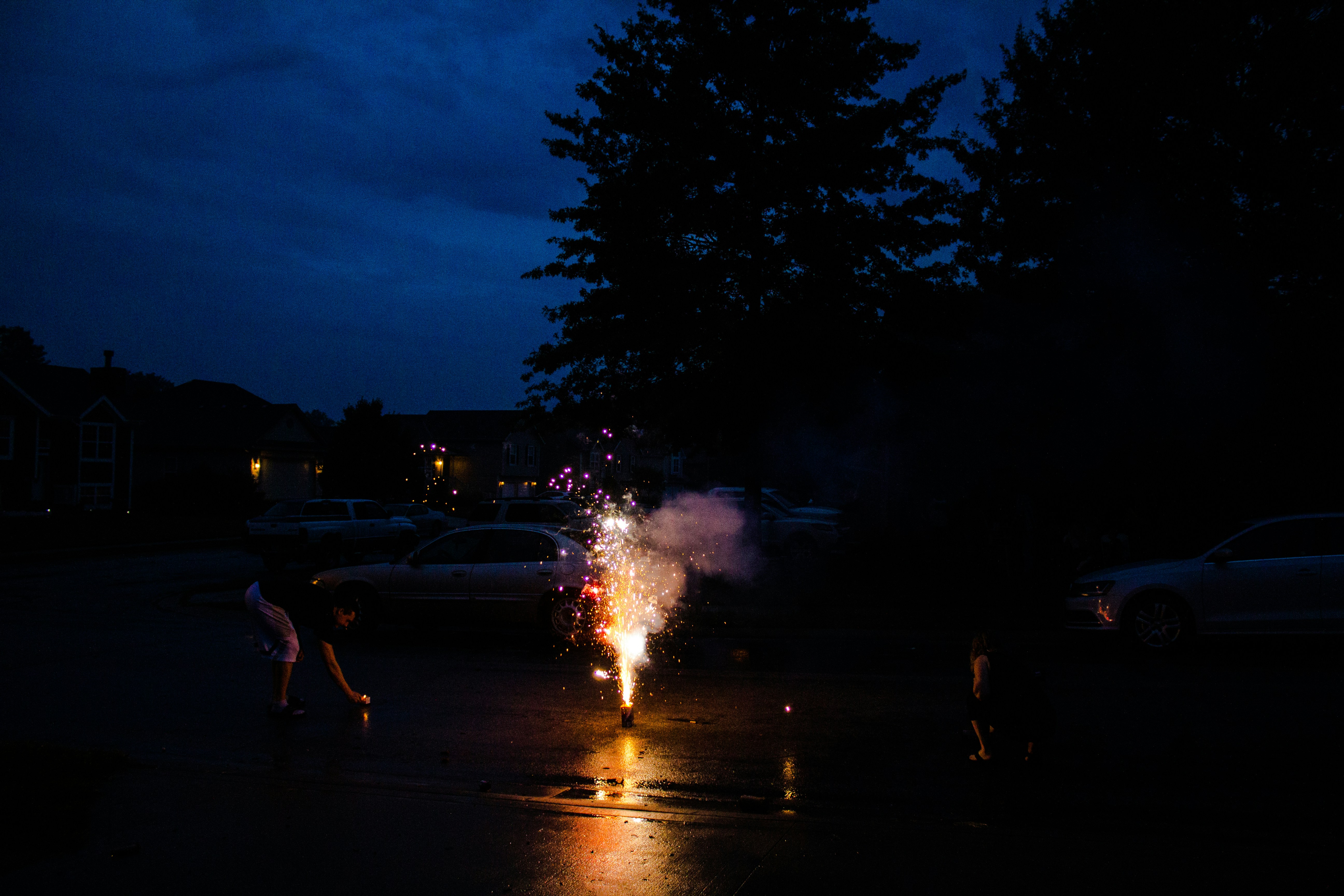 people walking on street during night time
