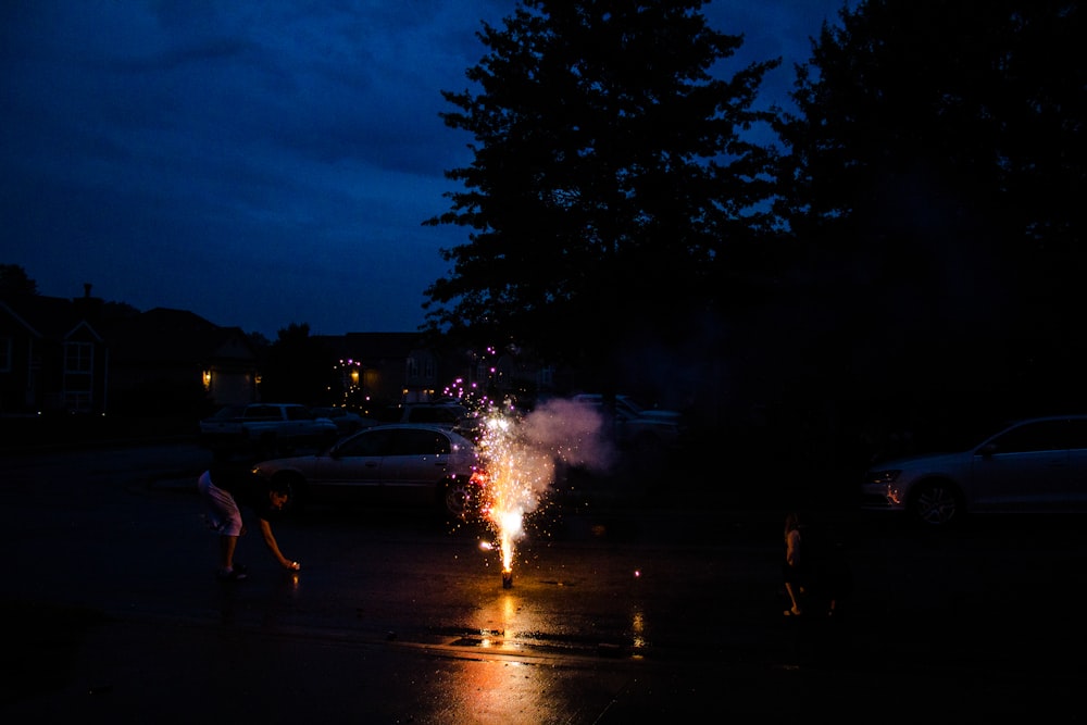 people walking on street during night time