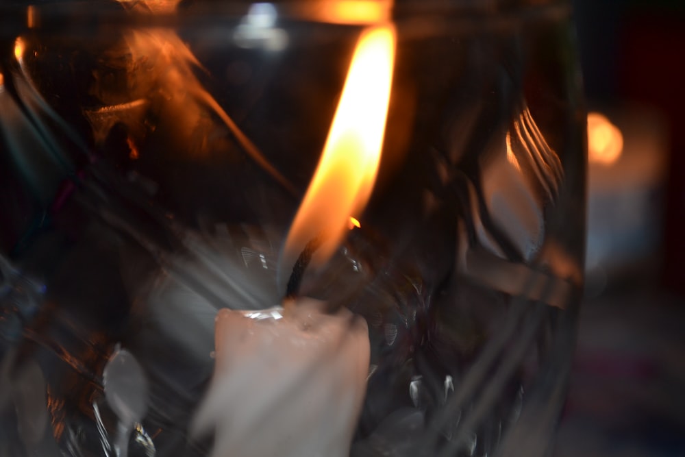 white candle on black surface