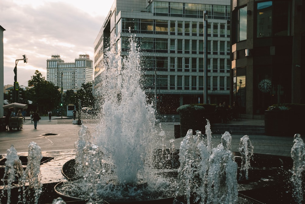 water fountain in front of building during daytime