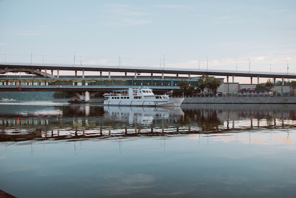 white boat on dock during daytime