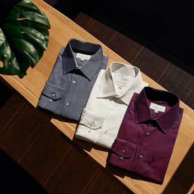 white button up shirt on brown wooden table