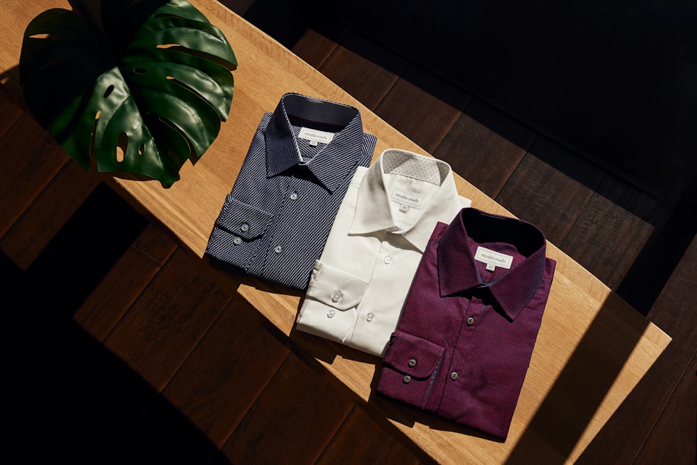 white button up shirt on brown wooden table