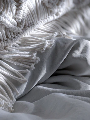 Close-up image showing the intricate weave and texture of a cozy wool blanket.