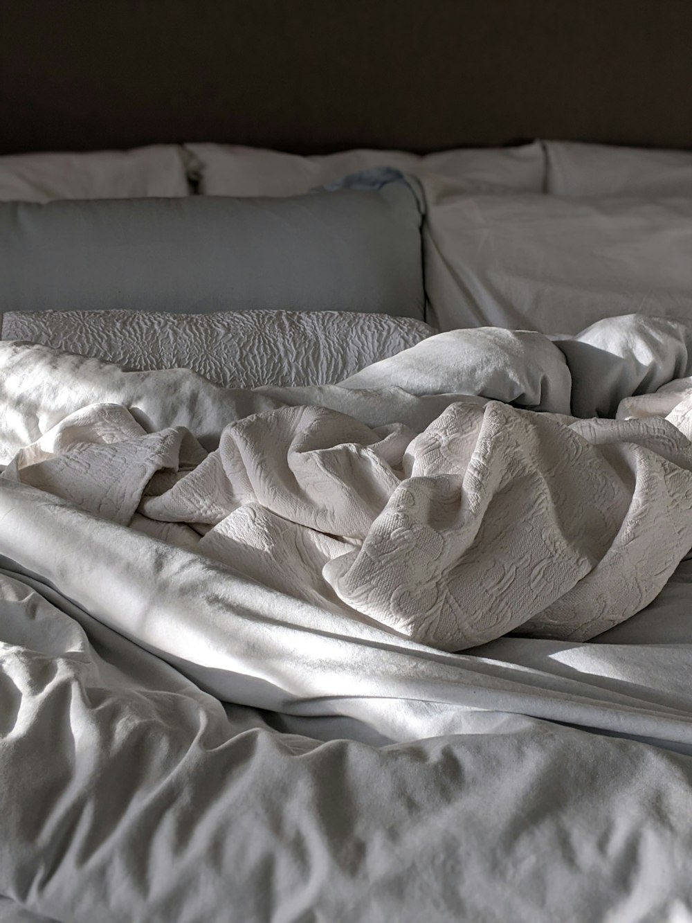 white and gray floral blanket