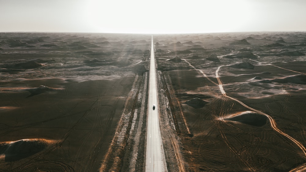 aerial view of road beside sea during daytime