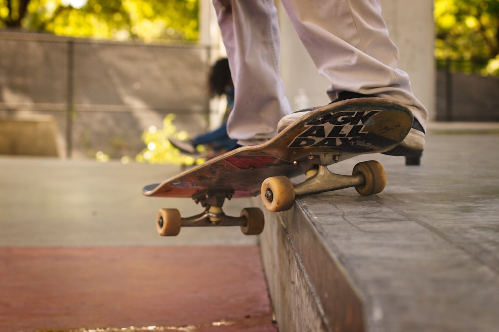 brown wooden skateboard on gray wooden bench