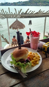 A beautiful arrangement of crispy fries and a milkshake.