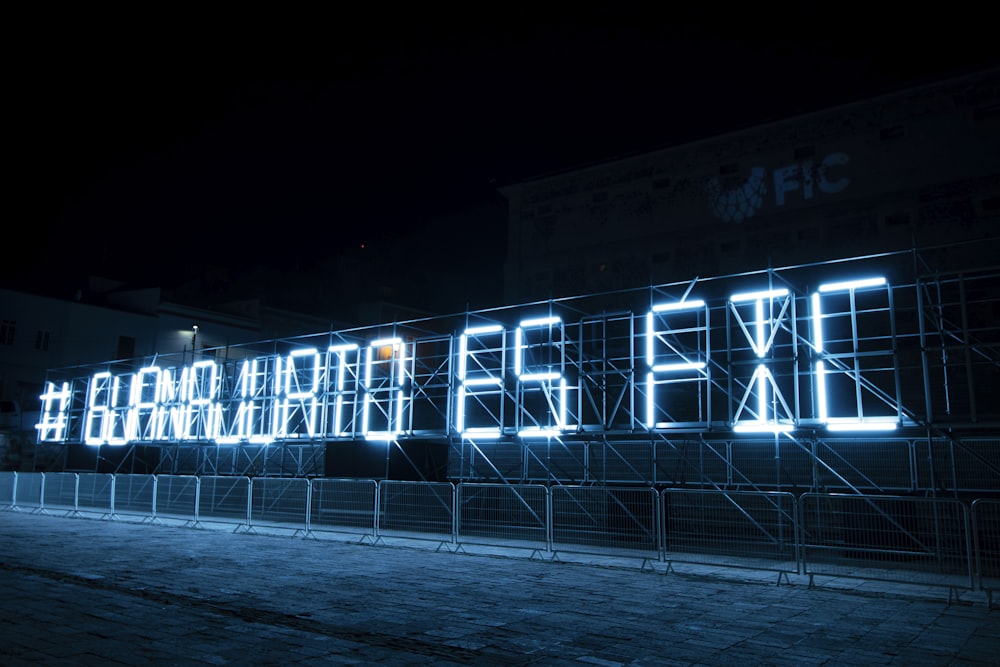 lighted building with blue lights during night time