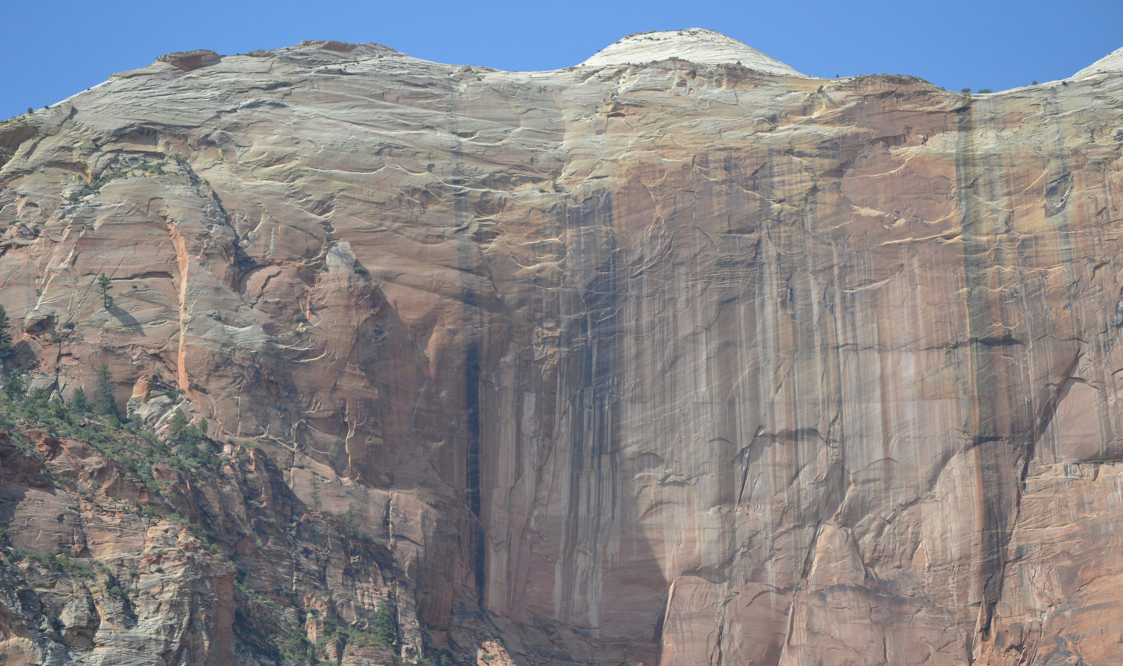 brown rocky mountain under blue sky during daytime