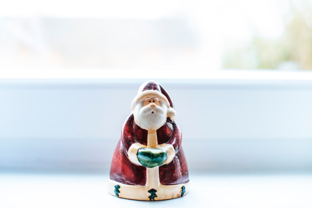 santa claus ceramic figurine on white table