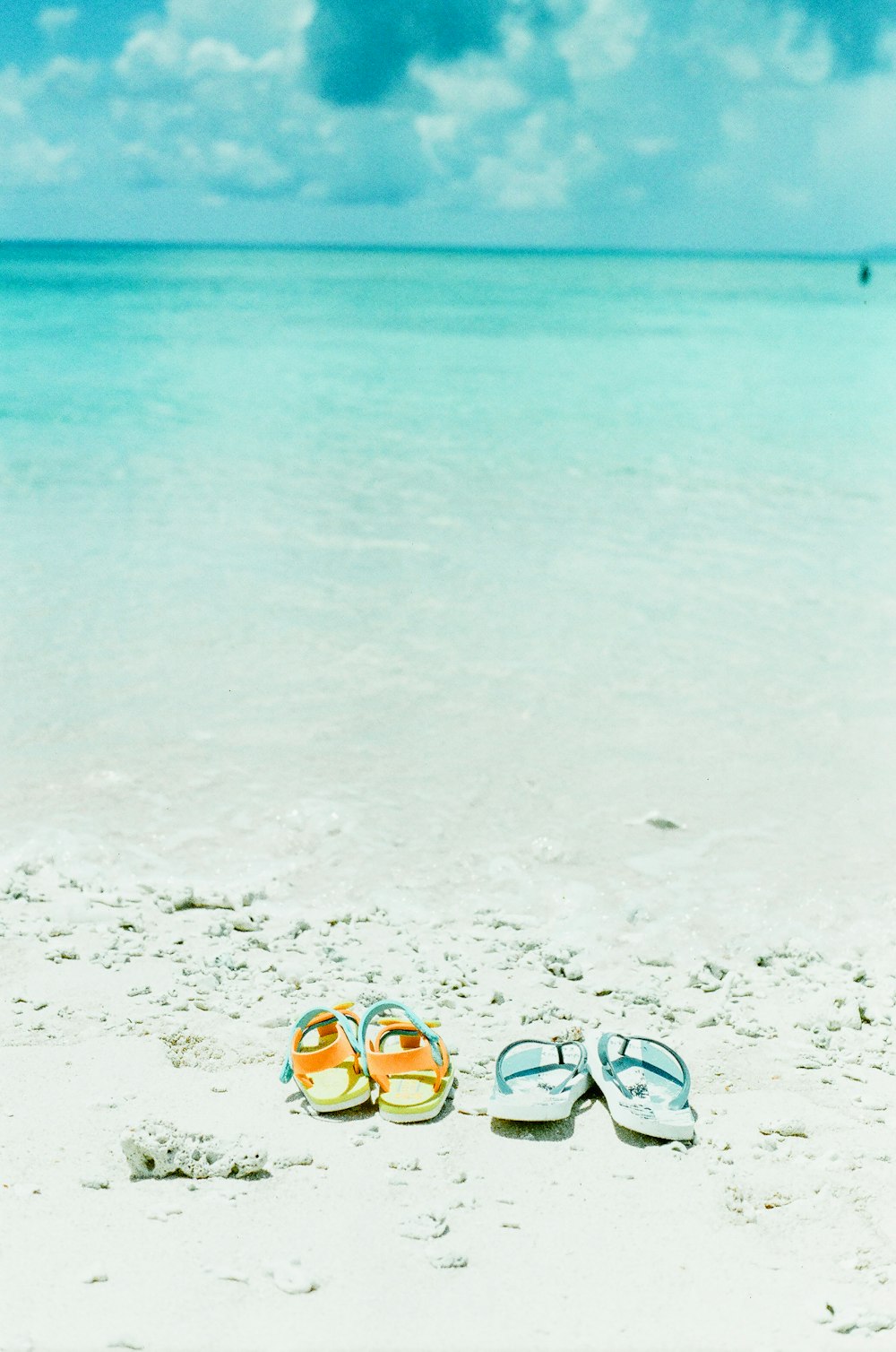 yellow and black sunglasses on beach during daytime