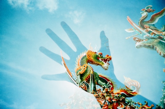 A playful illustration of a friendly dragon holding a colorful envelope, with the brand colors #420070, #f2ceff, #59d333, and #a5f7ff in the background.