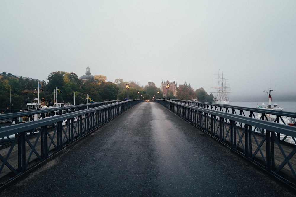 gray concrete bridge over river