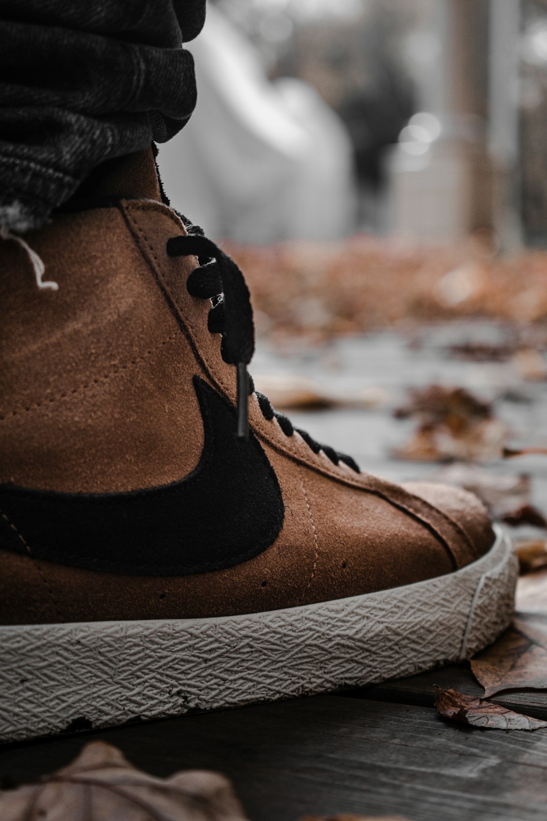 person wearing brown leather boots