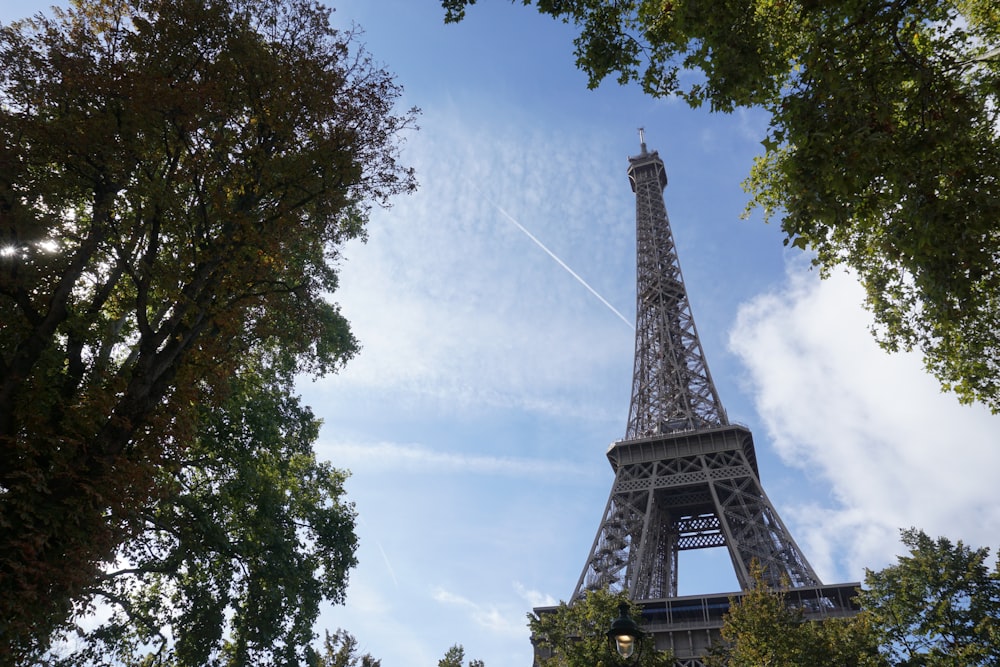 eiffel tower under white clouds during daytime