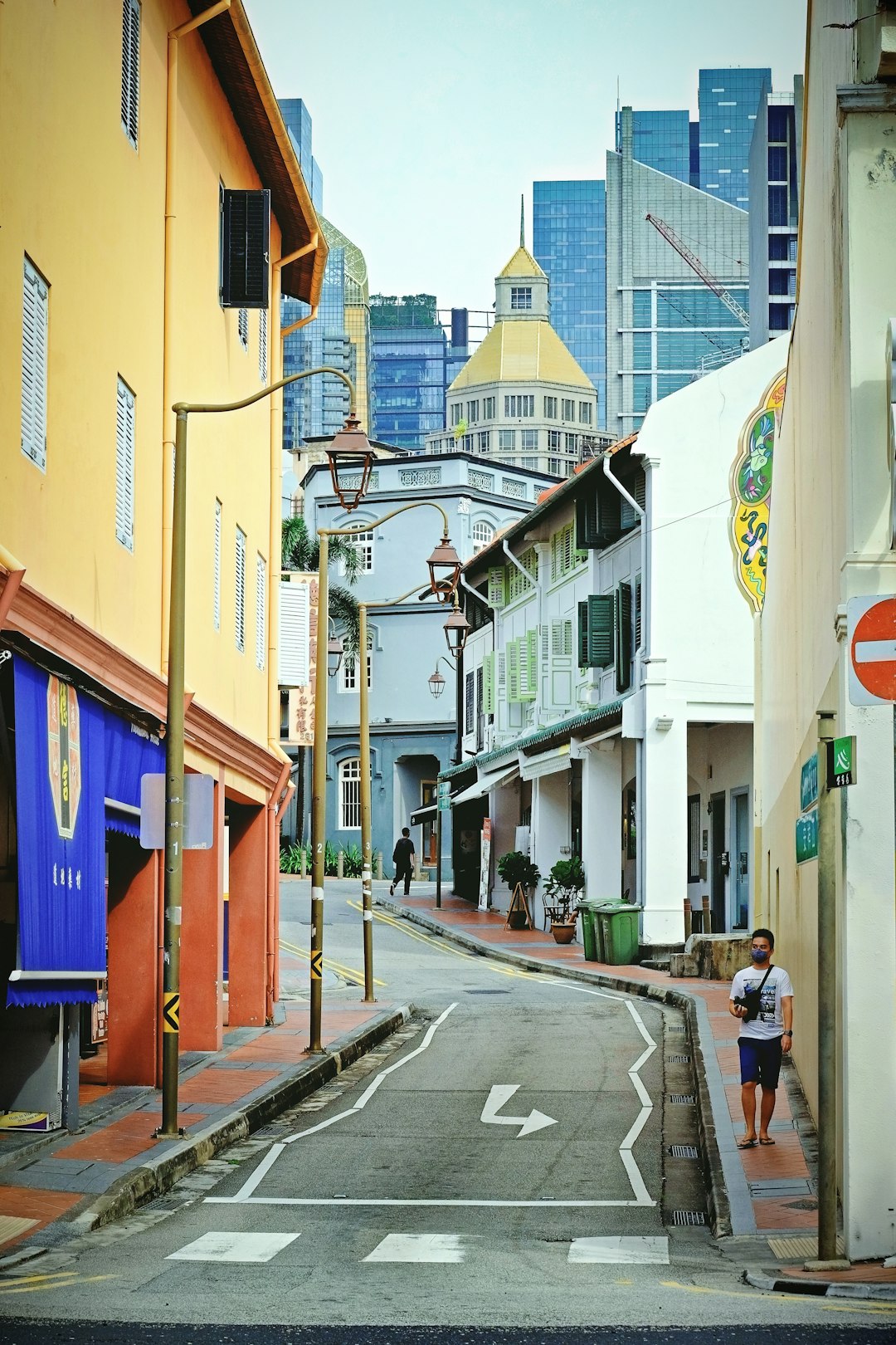 people walking on sidewalk near buildings during daytime