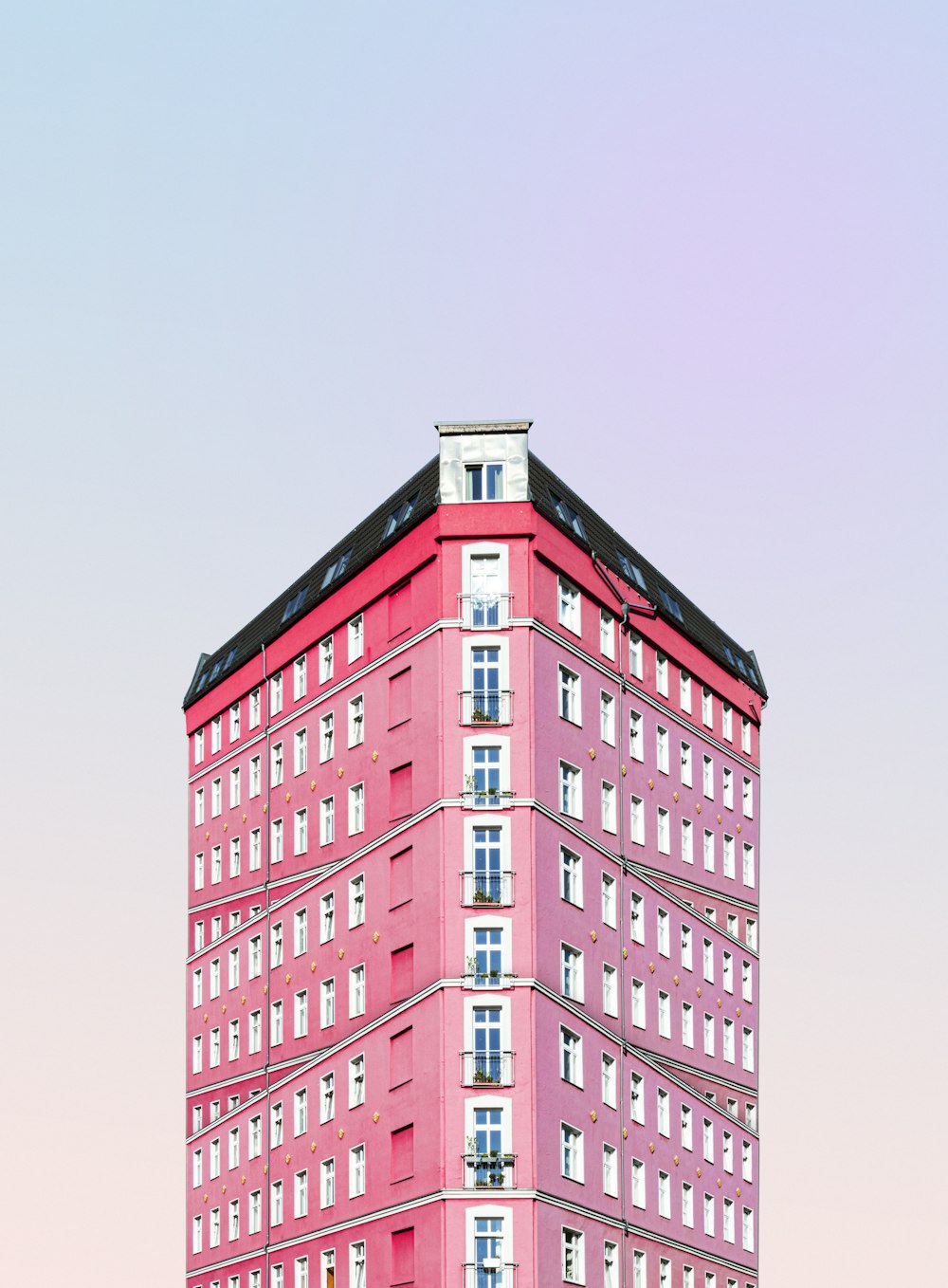 red concrete building under white sky during daytime