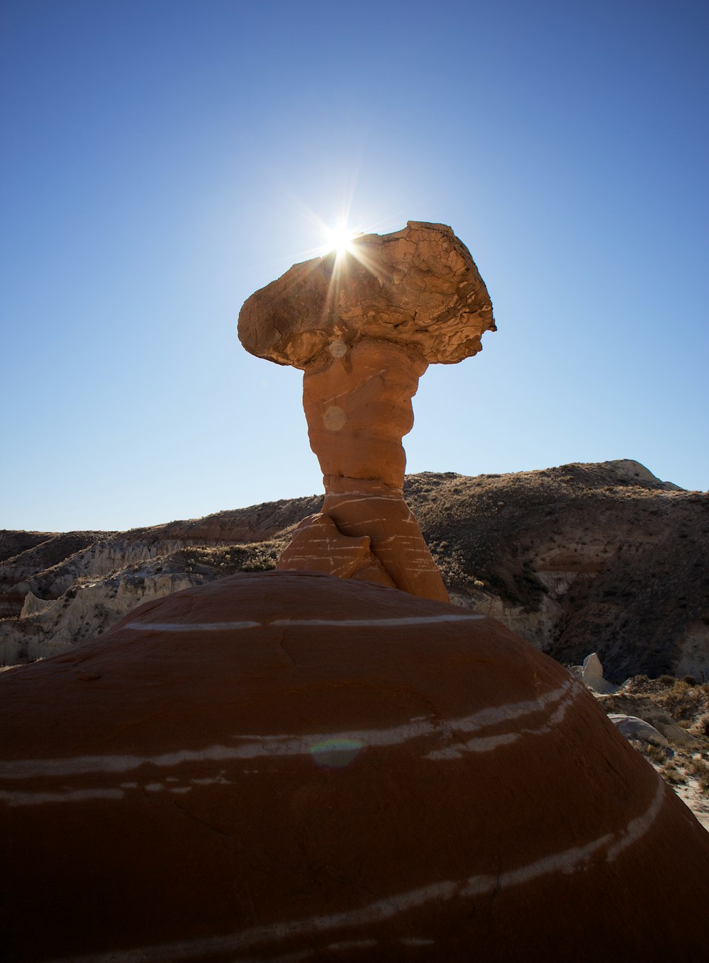 brown rock formation under blue sky during daytime