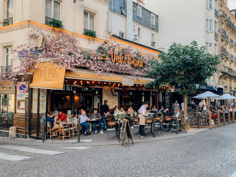 people sitting on chair near building during daytime