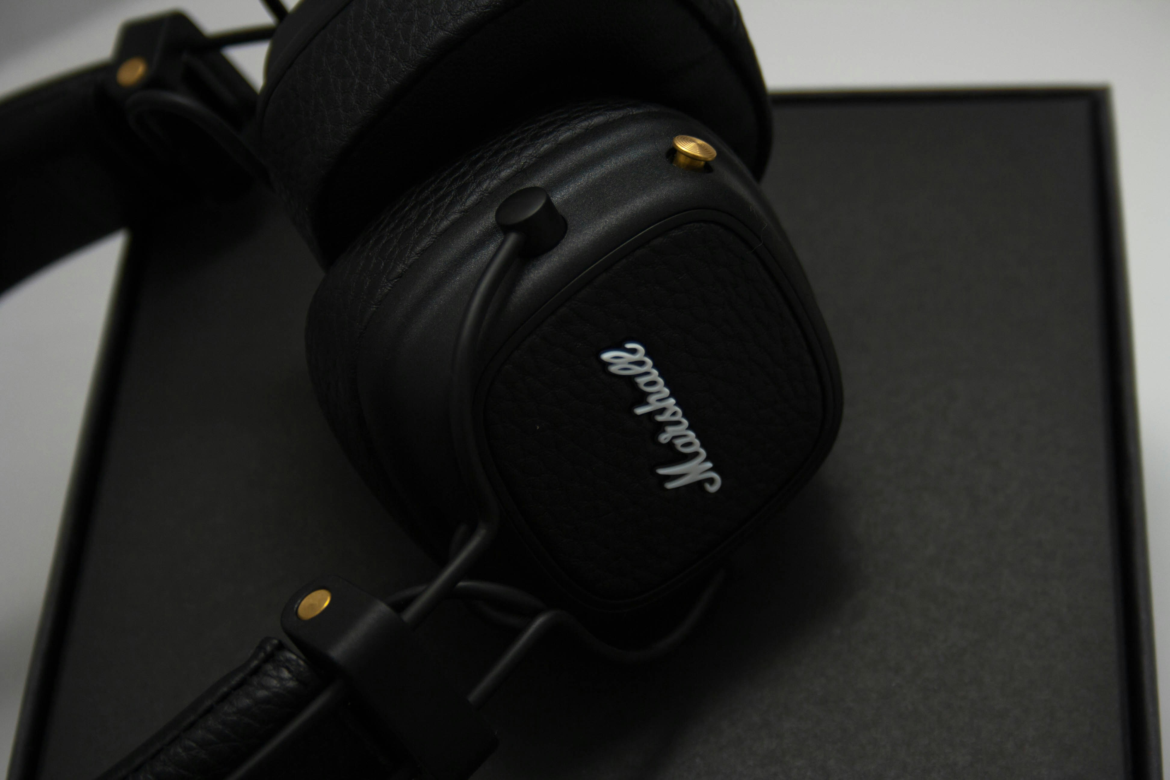 black sony headphones on black table