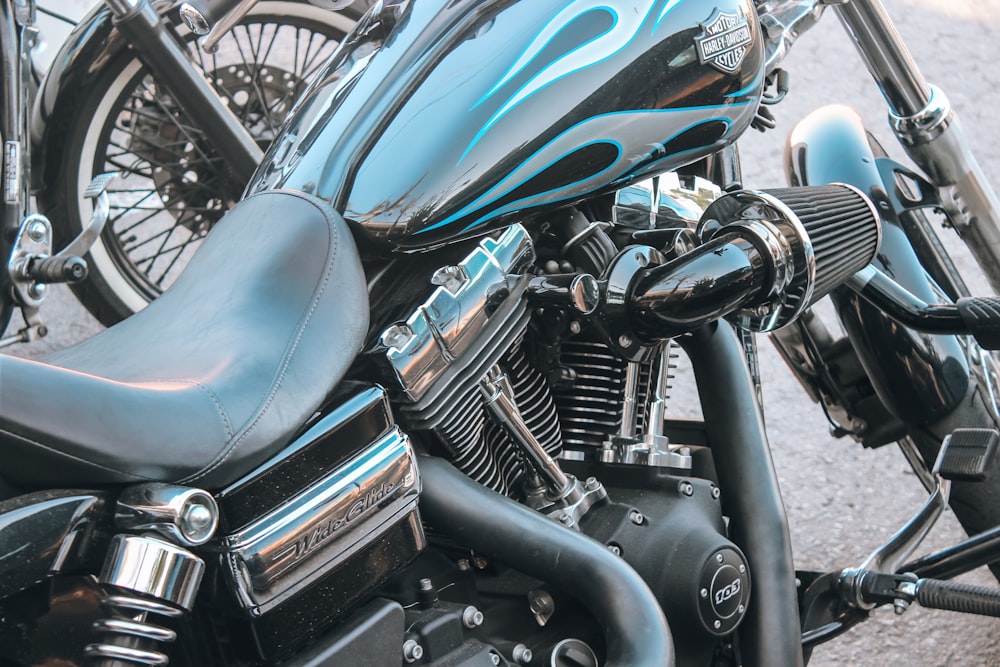 black and silver motorcycle on gray concrete floor