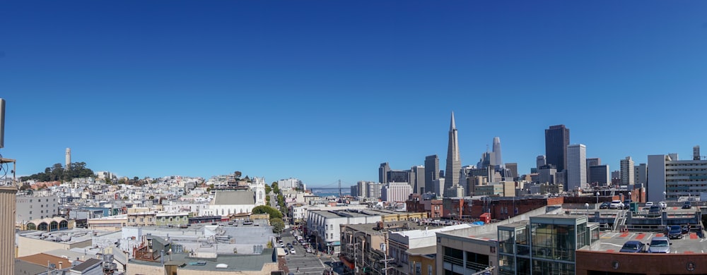 city buildings under blue sky during daytime