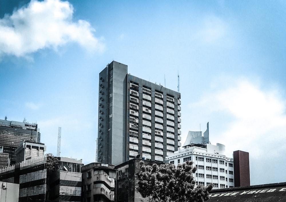 white and black concrete building under blue sky during daytime