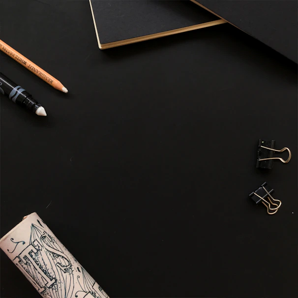 Minimalist black and gold aesthetic workspace with elegant branding elements