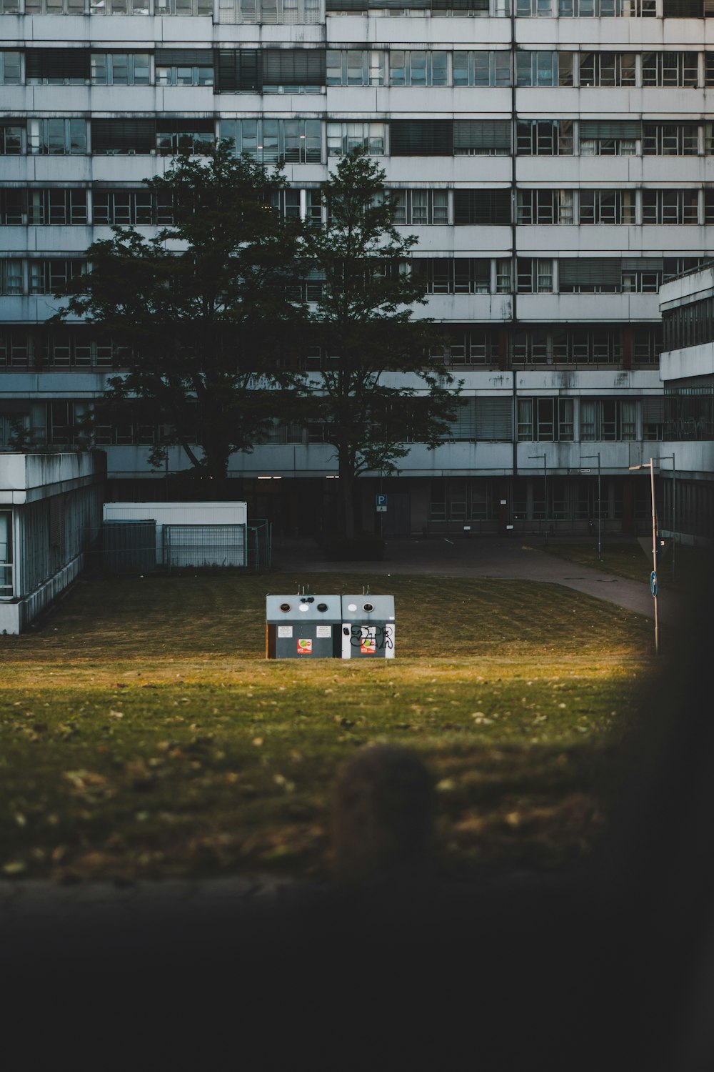 white concrete building near trees during daytime