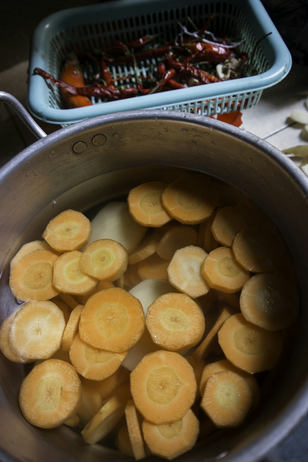 brown round food in stainless steel container