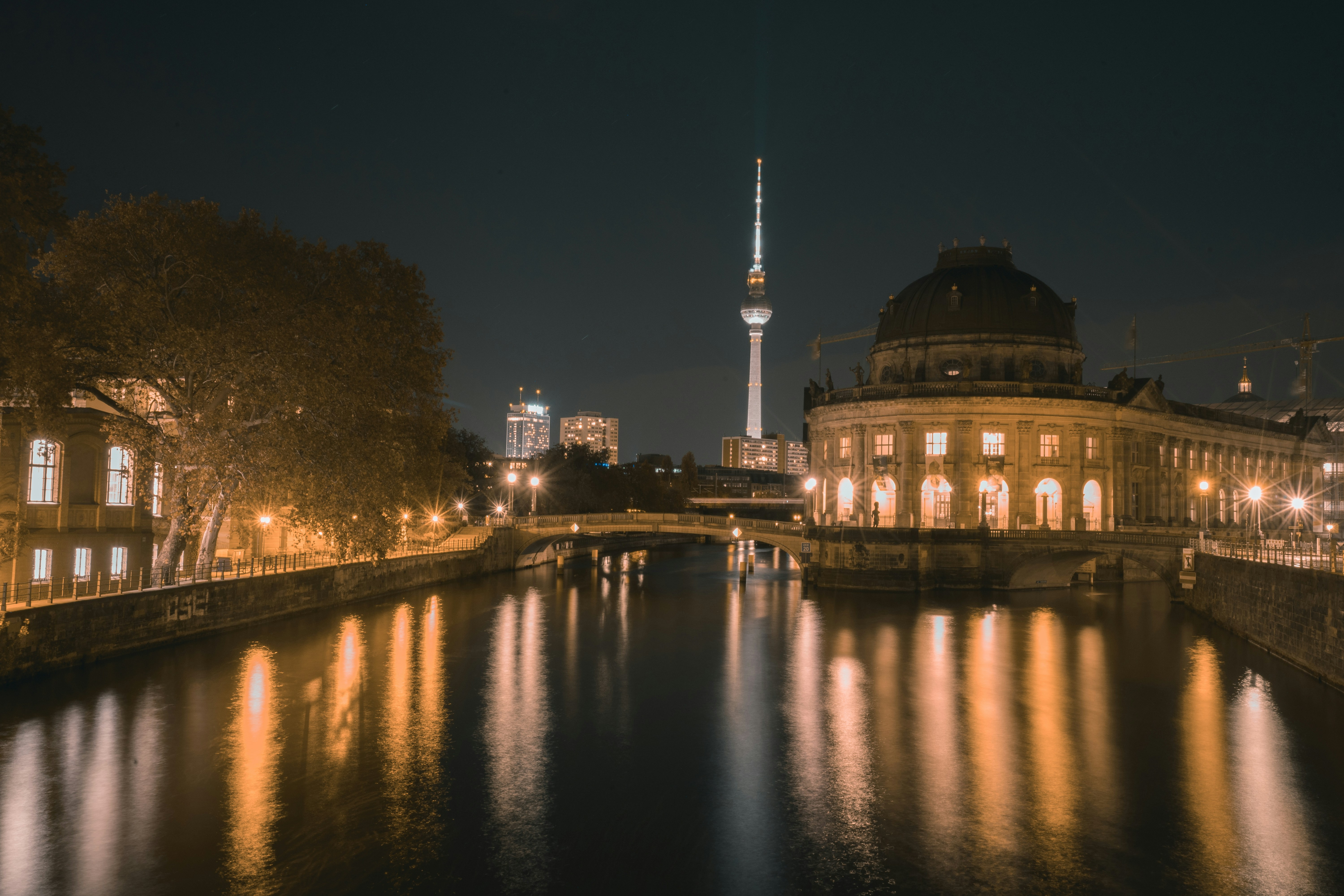 white dome building near body of water during night time