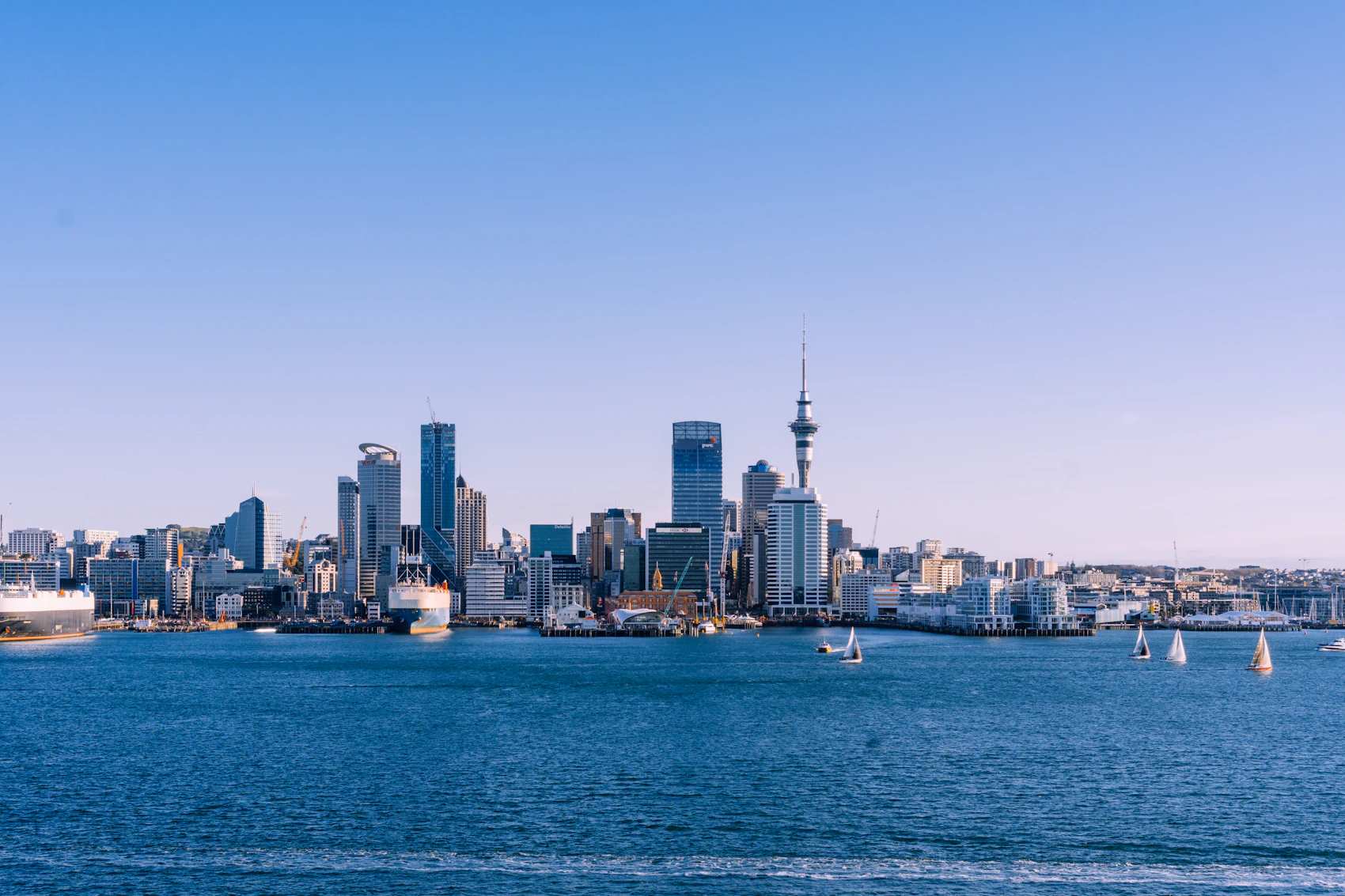 Auckland skyline beneath dramatic changing weather