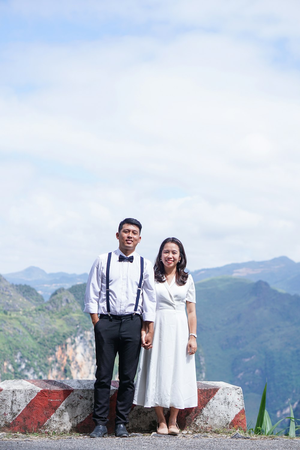 man in white dress shirt beside woman in white long sleeve shirt