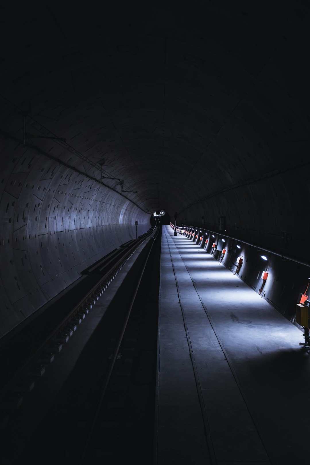 people walking on tunnel during night time