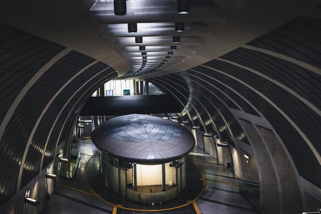 white and black tunnel with glass windows