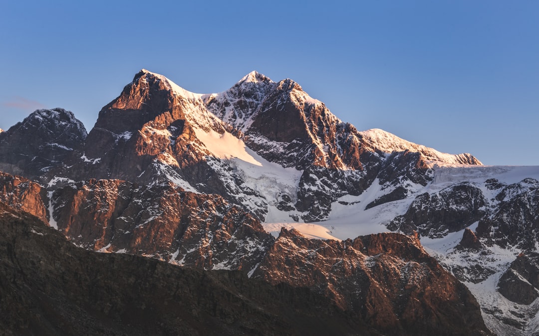 snow covered mountain under blue sky during daytime