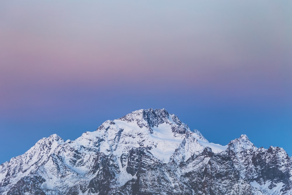 snow covered mountain during daytime