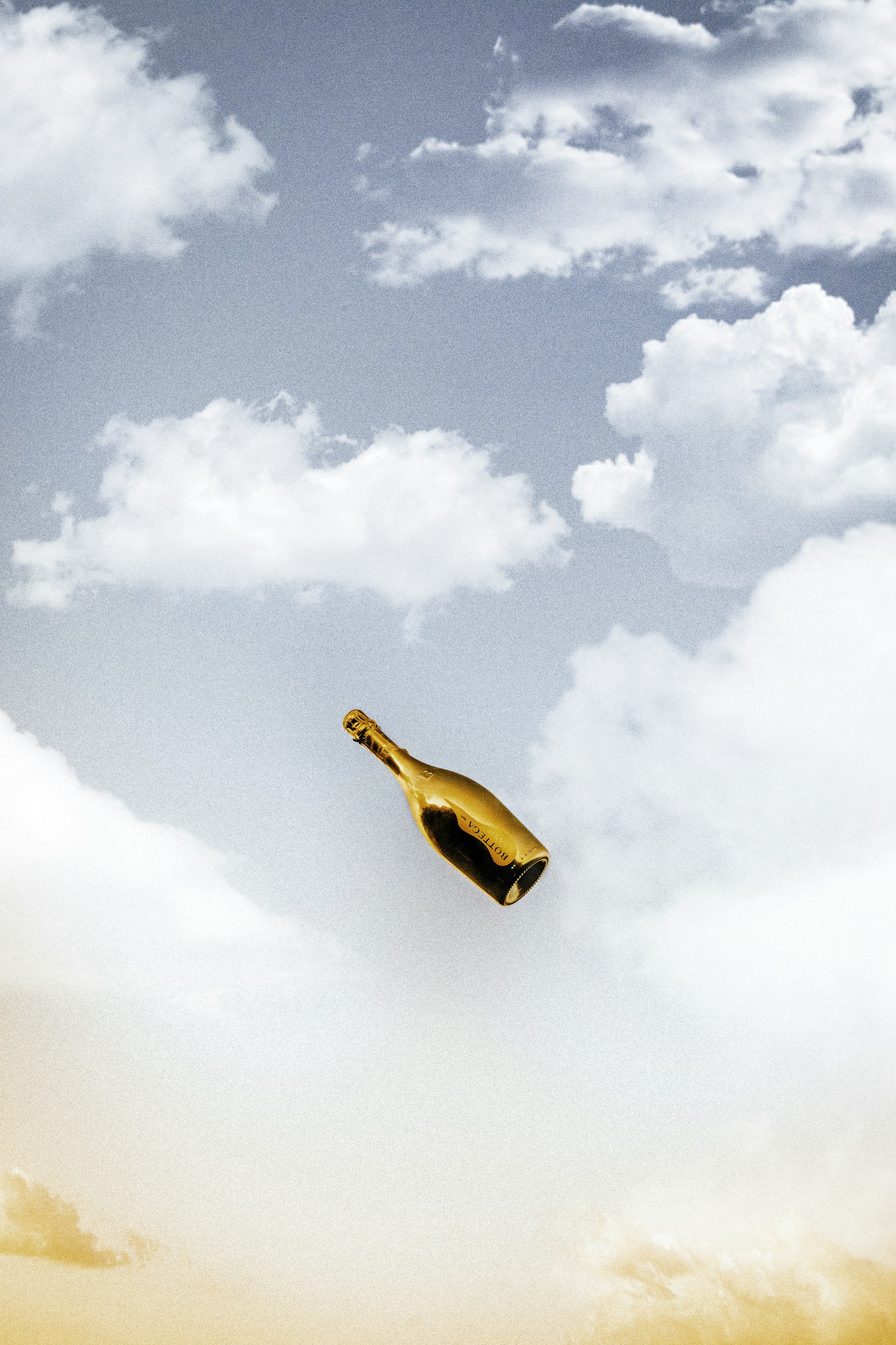 person in yellow shirt raising right hand under blue sky and white clouds during daytime