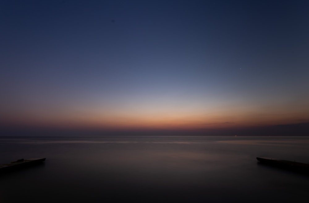 body of water under blue sky during daytime