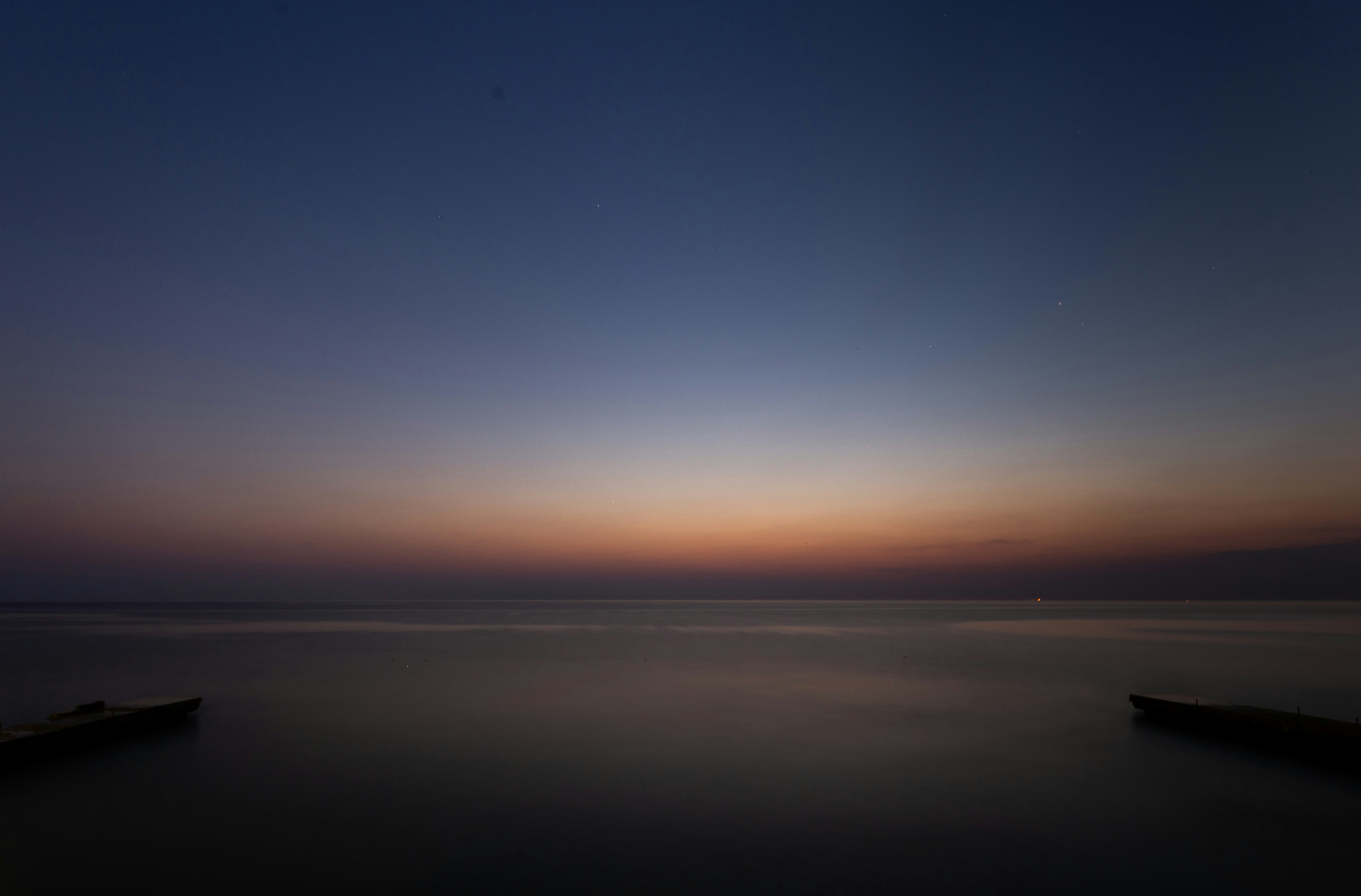 body of water under blue sky during daytime