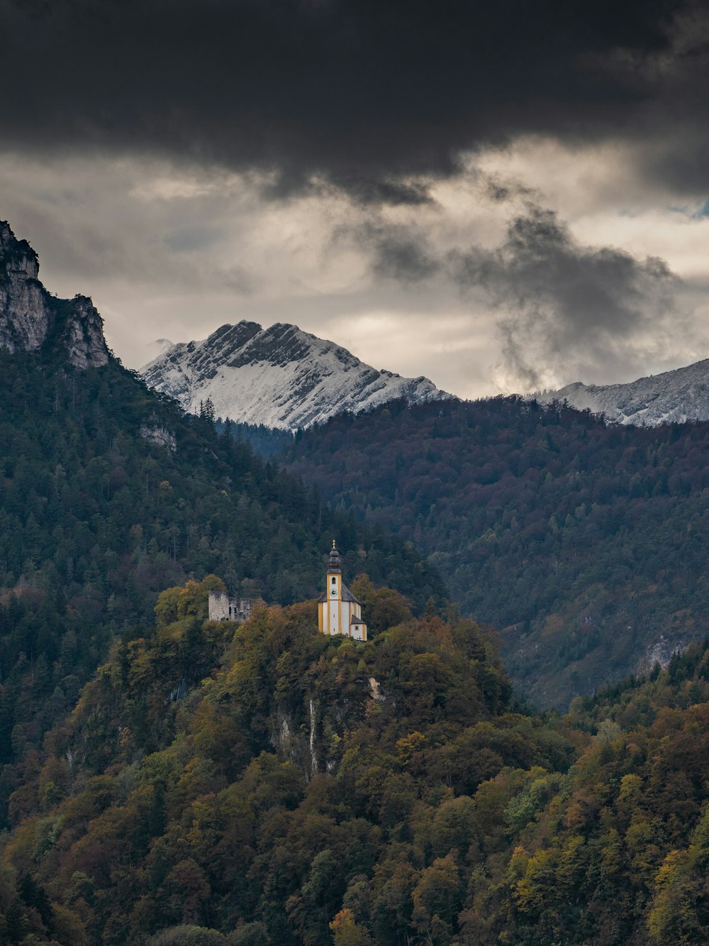 white concrete building on top of mountain