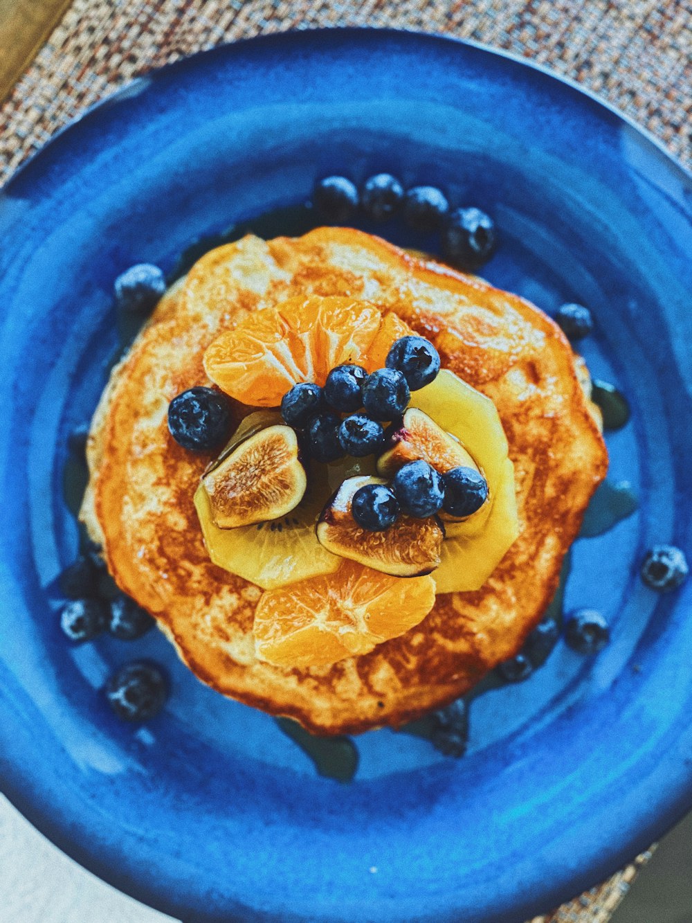 blue berries on blue ceramic plate