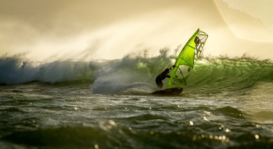 man surfing on sea waves during daytime in Milnerton South Africa