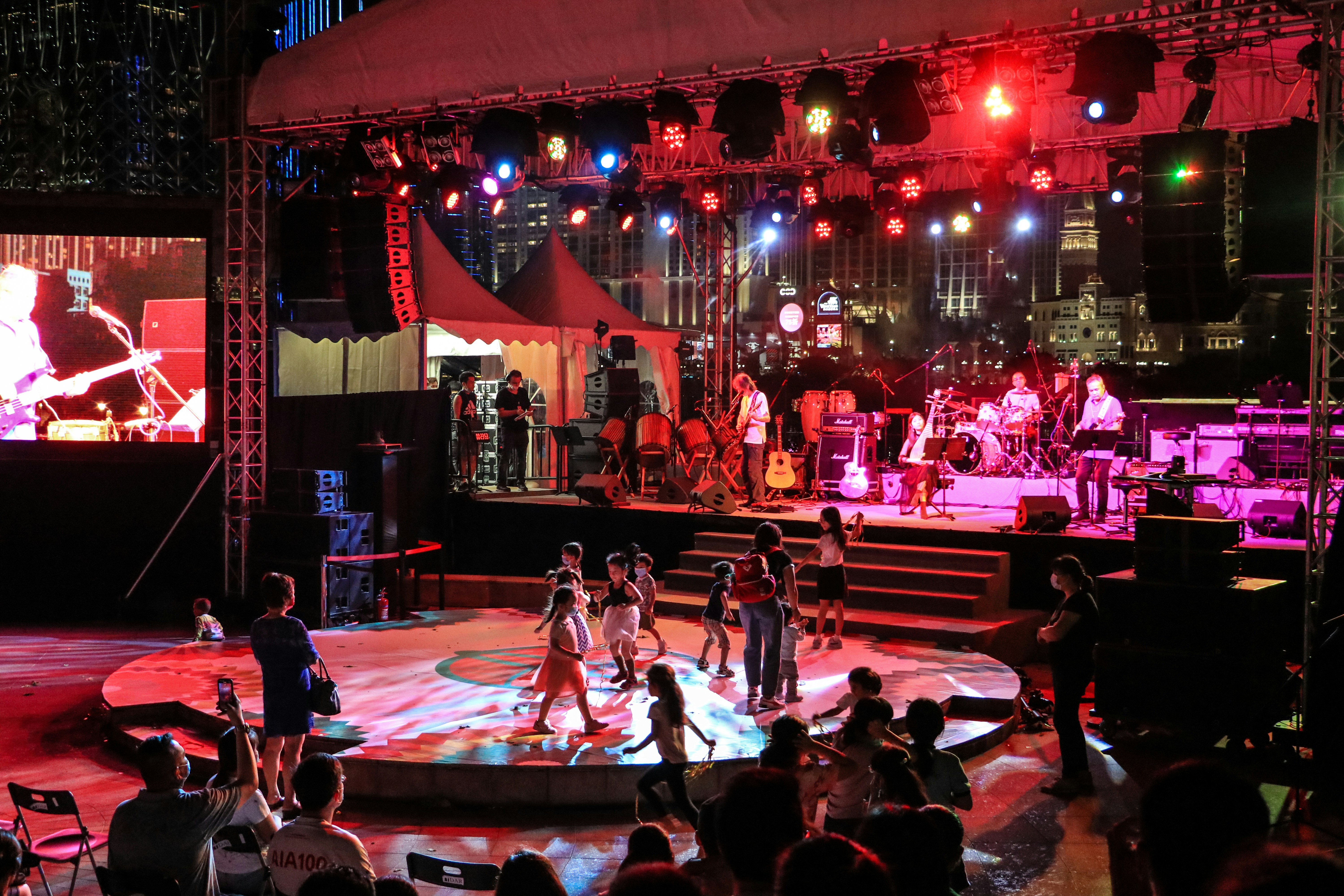 people sitting on chair on stage guinea-bissau teams background