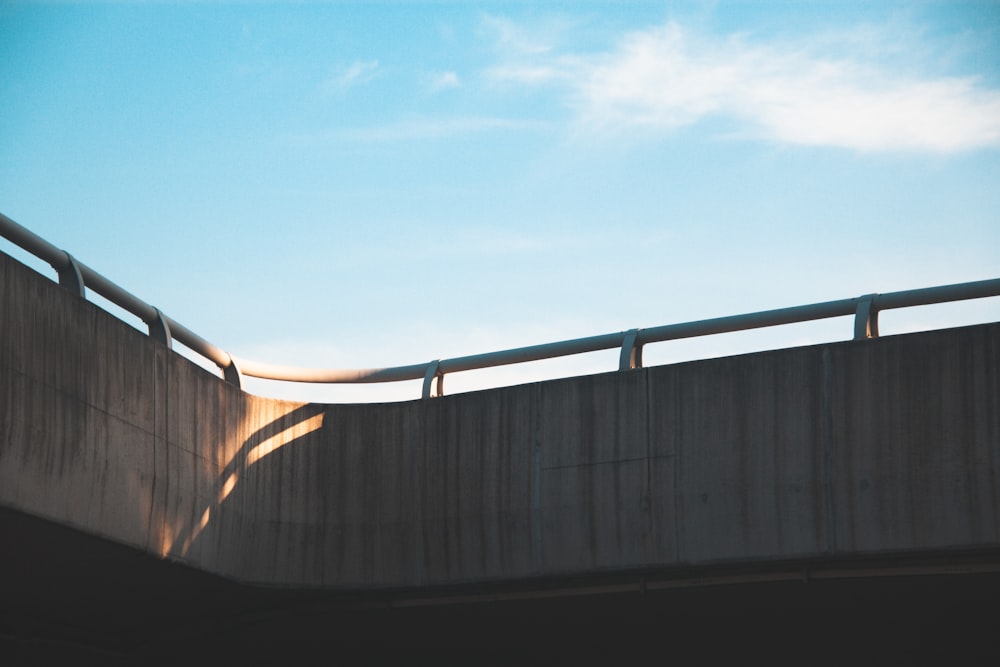 gray concrete wall under blue sky during daytime