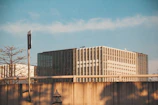 Modern portable office cabin set against a Qatar industrial backdrop under clear skies.
